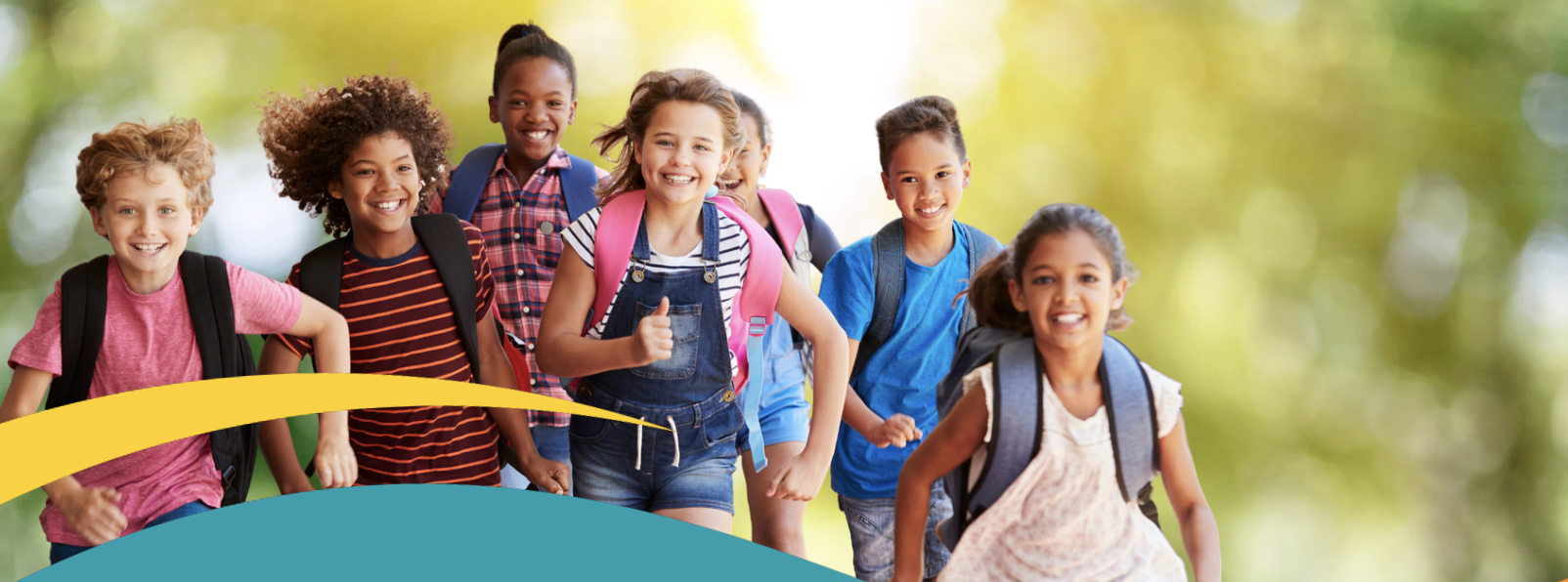School kids running wearing backpacks