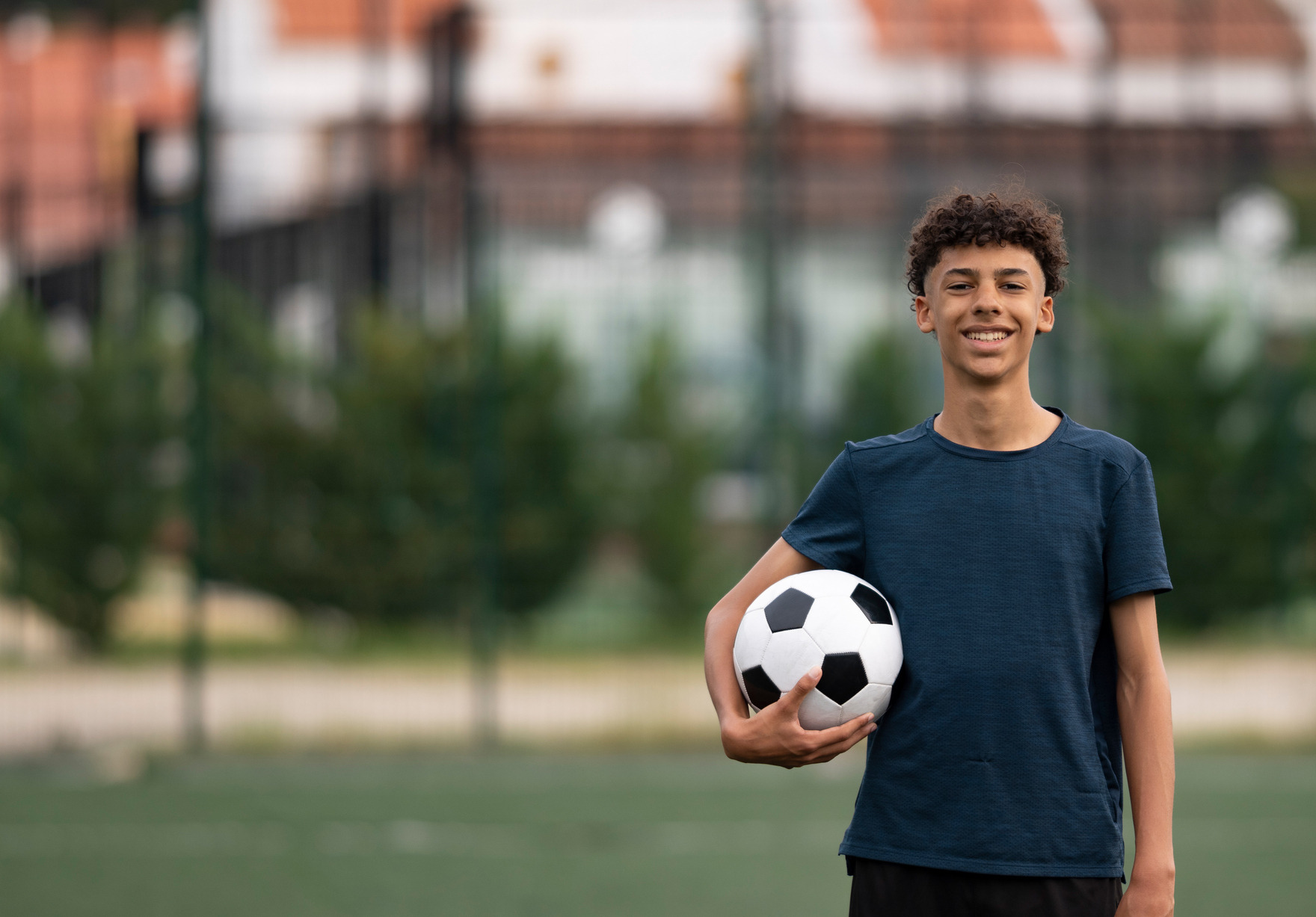 Student holding a soccer ball
