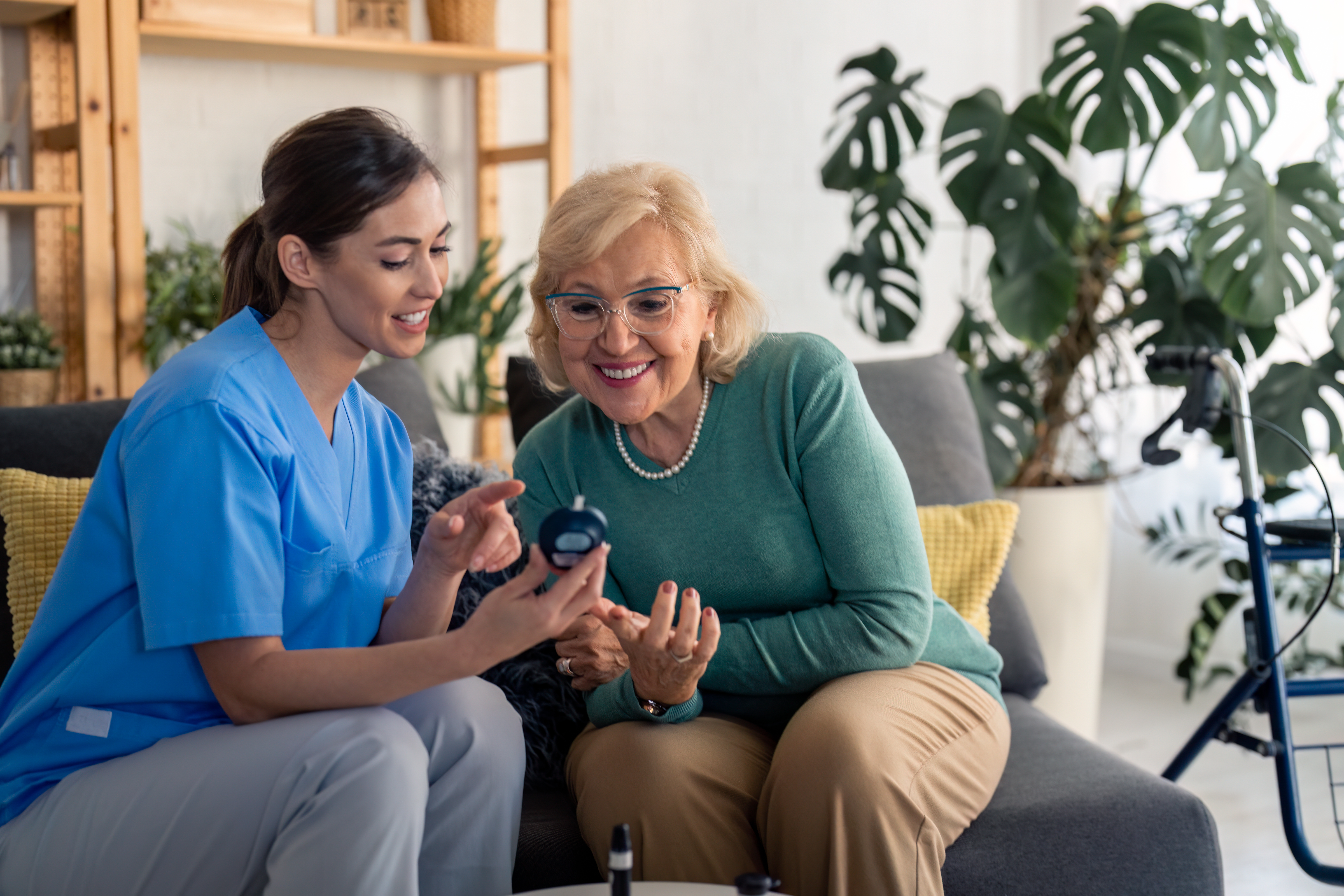 Health care worker showing patient glucometer